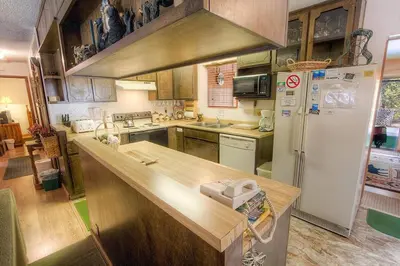a kitchen with a counter top and a refrigerator at Bambi's Bunkhouse home in South Lake Tahoe