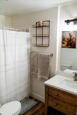 a bathroom with a toilet and a sink at Truckee River Ranch in Reno