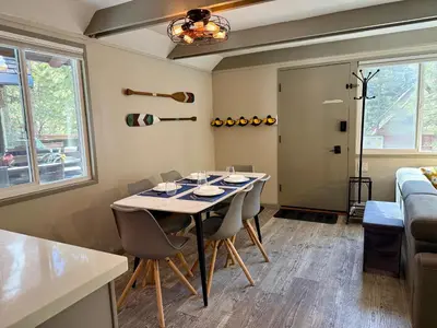 a dining room with a table and chairs at Tahoe Time Cabin in Incline Village