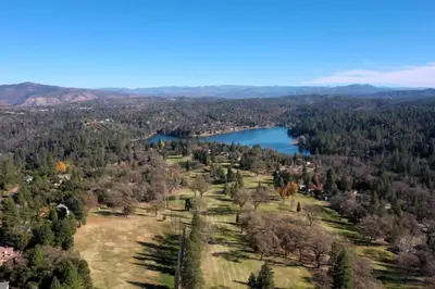 an aerial view of a park and a lake at Above the Green in Groveland