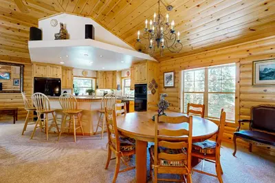 a kitchen and dining room with a table and chairs at Spacious Deck with Private Hot Tub Kings Beach Gem in Wood Vista