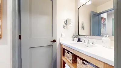 a bathroom with a sink and a mirror at Bigwood #45 condo in Mammoth Lakes