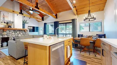 a kitchen and living room with a table and a couch at Bigwood #45 condo in Mammoth Lakes