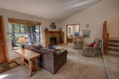 a living room with a couch and a fireplace at Aspen View Lodge home in South Lake Tahoe