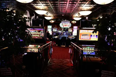 a casino with several slot machines in a room at Mizpah Hotel in Tonopah