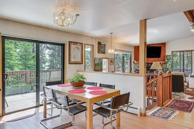 a dining room with a table and chairs at 1 Mi to Beach Peaceful Tahoe Vista Home with Decks! in Tahoe Vista