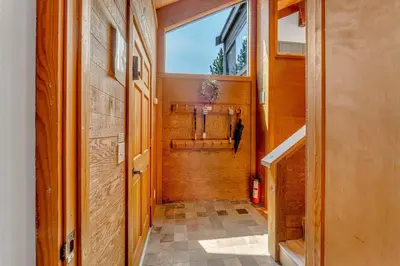 a hallway leading to a room with a window at Bright 3BR Condo Near Northstar in Truckee