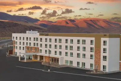 a rendering of a building with mountains in the background at Courtyard by Marriott Reno Sparks in Clark