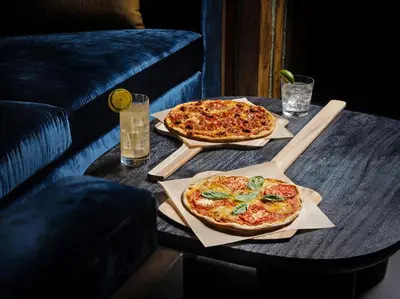 two pizzas sitting on top of a table at Chicken Ranch Casino Resort in Jamestown