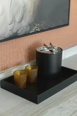 a black serving tray with three gold baskets on it at Chicken Ranch Casino Resort in Jamestown