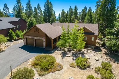 an aerial view of a home with a garage at The Restful Rose Fireside Vibes AC Comfort in Shaver Lake