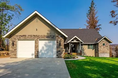 a house with a large garage at The Great Escape Sunsets Hot Tub Bliss in Shaver Lake