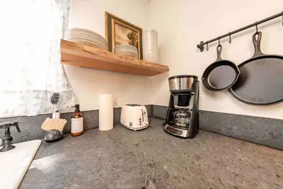 a kitchen counter with a toaster and a coffee maker at The Cedar House Prime Spot Kayaks & Cool AC in Shaver Lake