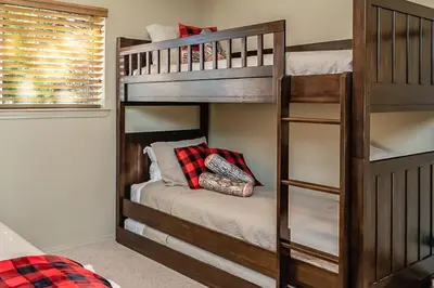 a bunk bed room with two bunk beds at Shady Pines Smores, Stars & Cozy Nights In in Shaver Lake