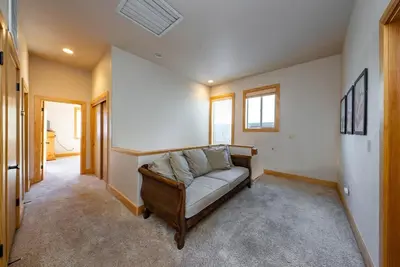 a living room with a couch in a room at Sierra Pines Villa Deck Jetted Tub Game Rm in Shaver Lake