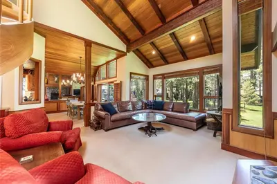 a living room with couches and a table at Chambers Lakeside Escape w Lake Views & HOA Access! in Homewood