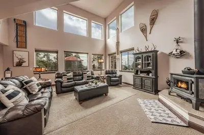 a living room filled with furniture and a fireplace at The Chalet at Shaver Lake We Have it ALL! in Shaver Lake