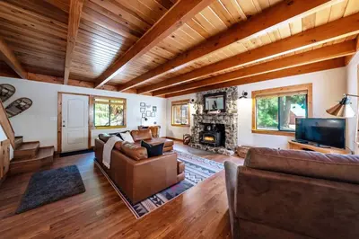 a living room with a couch and a fireplace at The Elderberry Retreat - It's a Dream Location! in Shaver Lake