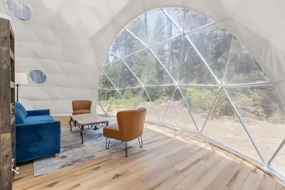 a room with a large arched window in a tent at Dome Sweet Dome | Shaver Lake in Shaver Lake