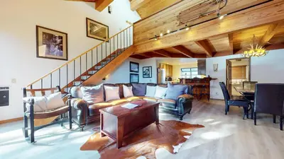 a living room with a couch and a table at Snowflower #75 condo in Mammoth Lakes