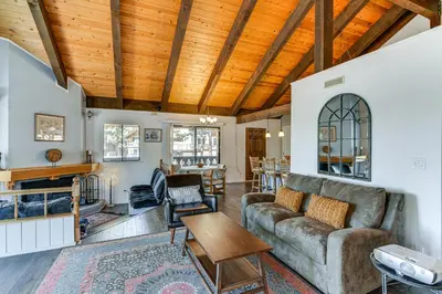 a living room with a couch and a table at Near Skiing and Beach Access South Lake Tahoe Cabin in South Lake Tahoe