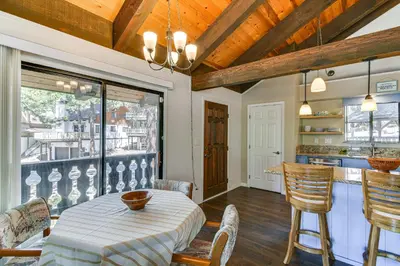a kitchen and dining room with a table and chairs at Near Skiing and Beach Access South Lake Tahoe Cabin in South Lake Tahoe