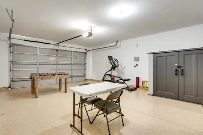 a garage with a table and a ping pong table at Clovis Retreat with Patio and Yard about 3 Mi to Old Town! in Clovis