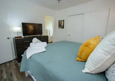 a bedroom with a bed with towels on it at Comfort meets Tranquility by the Sequoia Entrance in Three Rivers