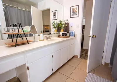 a white bathroom with a sink and a mirror at Comfort meets Tranquility by the Sequoia Entrance in Three Rivers