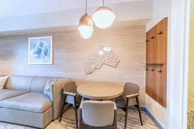 a living room with a couch and a table at Luxury 2 Bedroom Penthouse with Stunning Views! in Mammoth Lakes