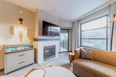 a living room with a couch and a fireplace at Luxury 2 Bedroom Penthouse with Stunning Views! in Mammoth Lakes