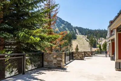 a balcony with a fence and a tree at Updated 2 Bedroom 2 Bathrooms 1849 Condos #109 Steps to Canyon Lodge Sleeps 6 in Mammoth Lakes