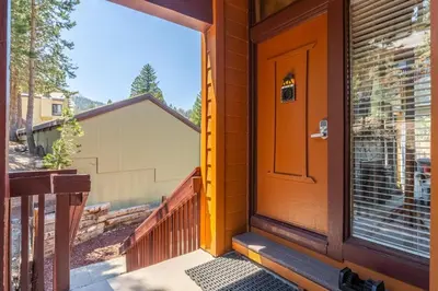 a front door of a house with a porch at Courchevel #15 - 2 Bedroom, 2 Bathroom, Sleeps 6! Just steps to Canyon Lodge! in Mammoth Lakes