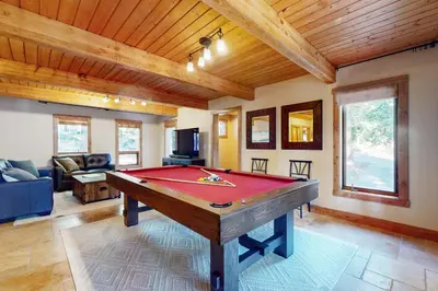 a living room with a pool table in it at Wild Horse Hideaway in Incline Village