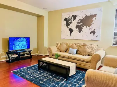 a living room with a couch and a tv at Cheerful & Spacious house to relax and unwind in Tracy