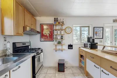 a kitchen with a stove and a counter top at 10 Mi to Bear Valley Resort Serene Mtn Retreat in Tamarack