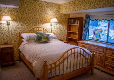 a bedroom with a large bed and a window at HighlandHouse in Arnold