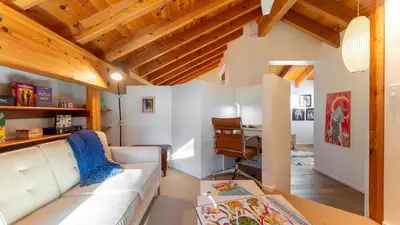 a living room with a white couch and a desk at Trapper by AvantStay A Interior Design w Sauna in Alpine Meadows