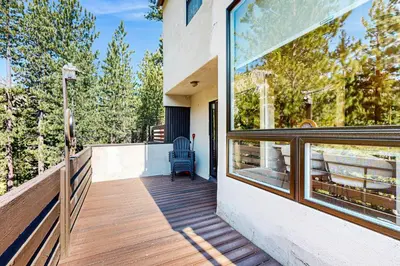 a balcony of a house with a window at Modern Mountain Getaway in Olympic Valley