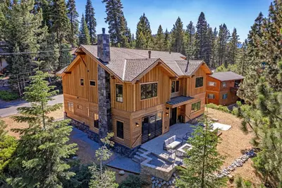 an aerial view of a large wooden house at Arcadia Manor on the West Shore - Newly Built - 5 BR w Wet Bar EV Charger and Air Conditioning in Tahoe City