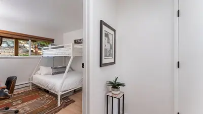 a room with a bunk bed and a desk at Tahoe Dreamin’ by AvantStay Central Location in Incline Village