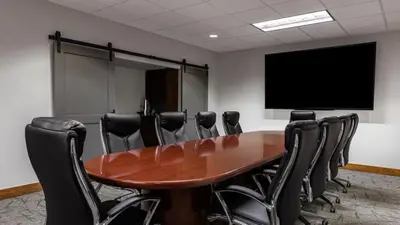 a conference room with a wooden table and black chairs at Marriott Grand Residence Luxury Studio sleeps 2 in South Lake Tahoe