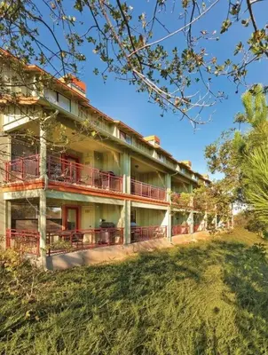 a building with red balconies on the side of it at WorldMark Angels Camp - 1BD in Angels Camp