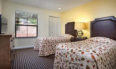 a hotel room with two beds and a window at WorldMark Angels Camp - 2BD in Angels Camp