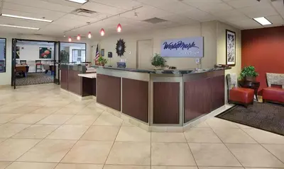 a lobby of a waiting room with a counter and chairs at Great 1BD condo with resort amenities take in all Reno has to offer in Reno