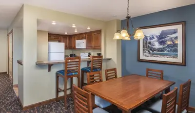a kitchen and dining room with a table and chairs at Worldmark Lake Tahoe - 1BD Sleeps up to 4 in Stateline