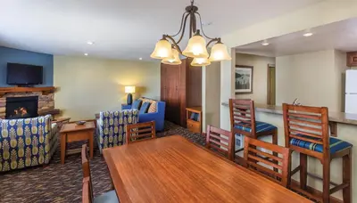 a dining room and living room with a table and chairs at Worldmark Lake Tahoe - 1BD Sleeps up to 4 in Stateline
