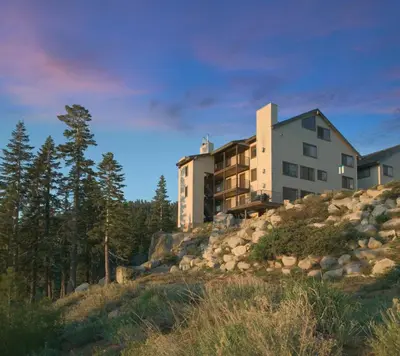 a building on top of a hill with trees at Worldmark Lake Tahoe - 1BD Sleeps up to 4 in Stateline