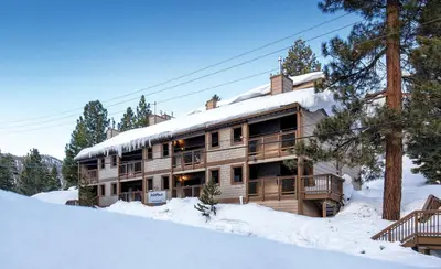 a large wooden house in the snow with snow at Worldmark Lake Tahoe - 2BD Sleeps up to 6 in Stateline