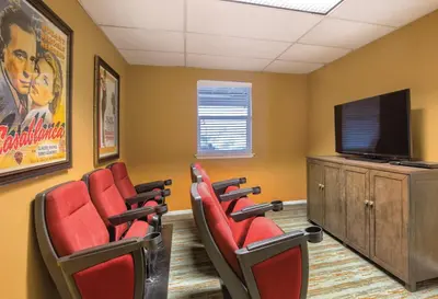 a waiting room with red chairs and a flat screen tv at Worldmark Lake Tahoe - 2BD Sleeps up to 6 in Stateline